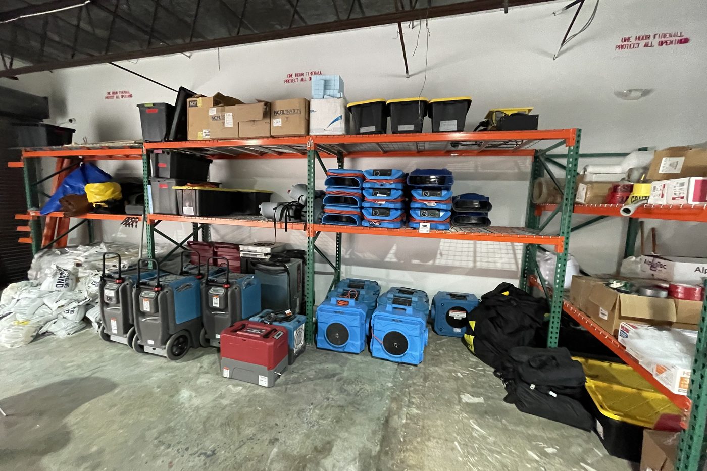 RapidDry warehouse stocked with air movers, dehumidifiers and water extractors